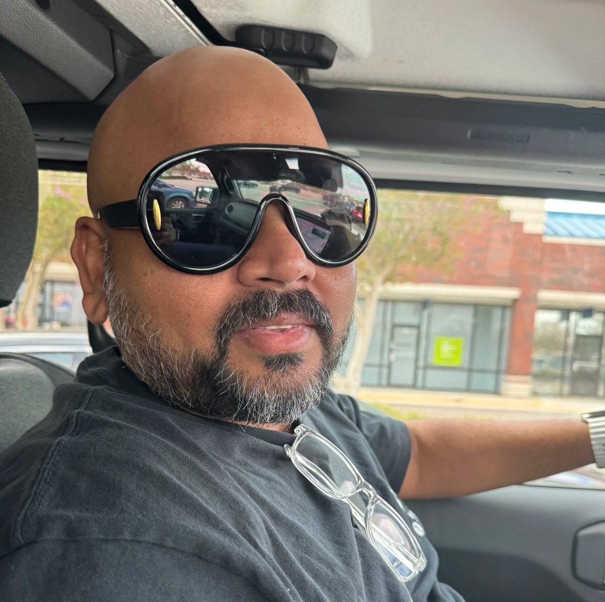 Satya wearing bold, funky eyeglass frames, a personal gift